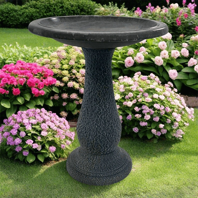 Cool Grey Fiber Clay Bird Bath in a garden, featuring a full-sized basin for bird watching, lightweight design, and a sturdy, matte finish pedestal.