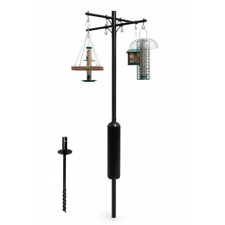 Black metal squirrel-proof bird feeder pole with a squirrel baffle and feeders hanging shown on a white background with a separate ground anchor visible.