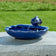 Ceramic Koi Solar Fountain with a koi spout in a scalloped bowl, recycling water to create a soothing garden ambiance.