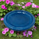 Azure fiber clay birdbath bowl surrounded by pink and purple flowers