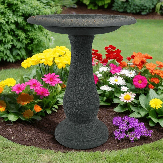 Sand Fiber Clay Bird Bath in a garden, featuring a full-sized basin for birds to play and splash. Lightweight and easy to move.