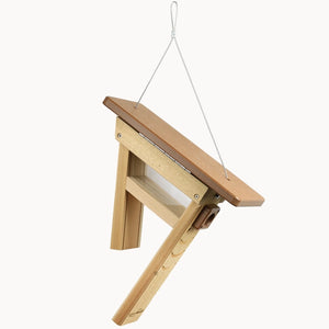 Hanging tail-prop peanut feeder with cedar frame and brown recycled plastic roof.