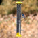 Nature's Way Bottoms Up Metal Thistle Finch Bird Feeder with yellow caps, metal perches, and a chickadee feeding, showcasing dual direction seed openings.