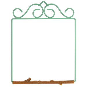 A decorative metal picture frame with a mint green scrollwork top and a rustic brown branch base, shown on a plain white background.
