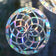 Mandala Window Gems, Set of 3, prismatic decals on a window, showcasing circular designs to prevent bird strikes and add elegance.