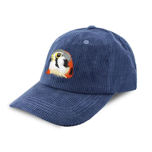 American Kestrel Corduroy Hat in Midnight Spruce features a navy corduroy fabric with an embroidered kestrel patch, curved brim, and adjustable strap.